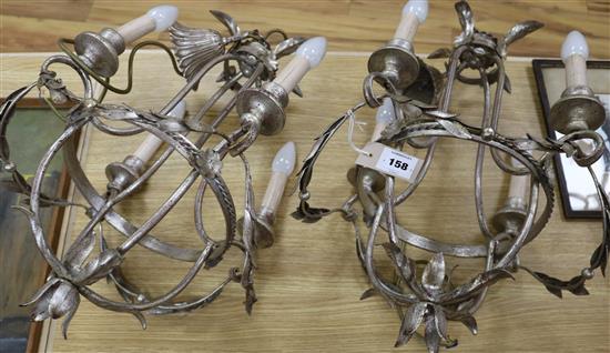 A pair of silvered modern light fittings